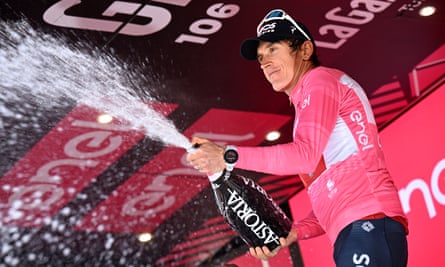 Geraint Thomas celebrates in the pink jersey
