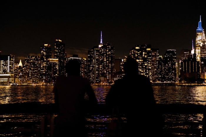 The Empire State Building is lit in purple and silver in celebration of the life and legacy of the late Queen Elizabeth II.