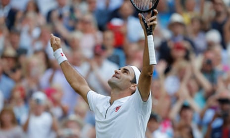 Federer celebrates after defeating Spain’s Rafael Nadal in four sets.
