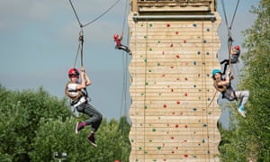 Kids on climbing wall and zipwires at Kingswood Dearne Valley, South Yorkshire.