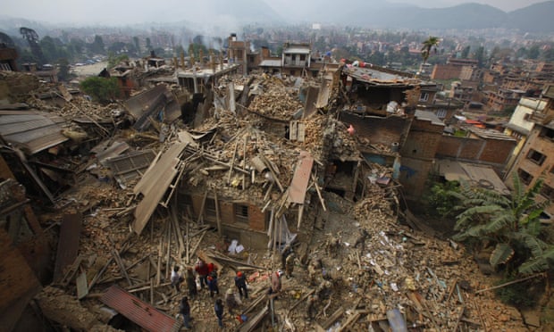 Rescue workers remove debris as they search for victims of the earthquake in Bhaktapur near Kathmandu, Nepal. 