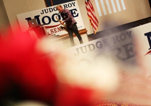 A musician performs for the crowd at the watch party for Republican Senate candidate Roy Moore in Montgomery