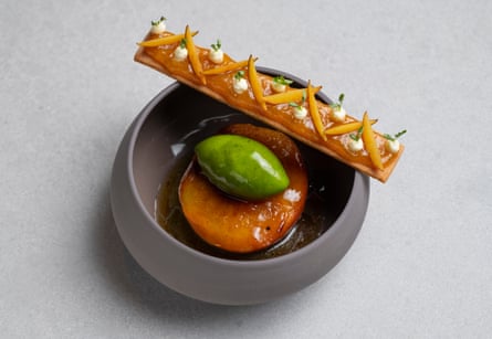 Peach poached in amaro Montenegro, ‘served with a vibrant green herb sorbet’, at Amethyst, London.