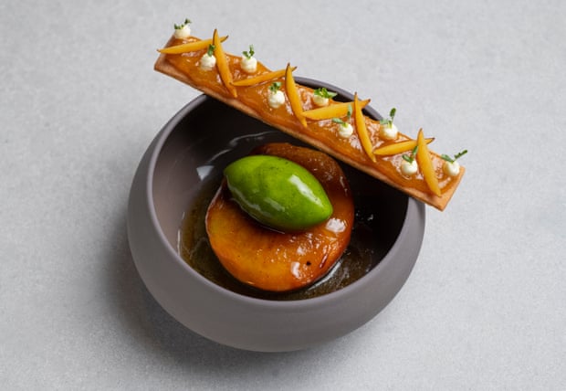 Peach poached in amaro Montenegro, 'served with a vibrant green herb sorbet', at Amethyst, London.