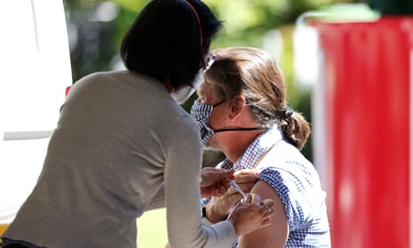 A woman receives a vaccination at a pop-up vaccination clinic at the State Library Victoria, in Melbourne.