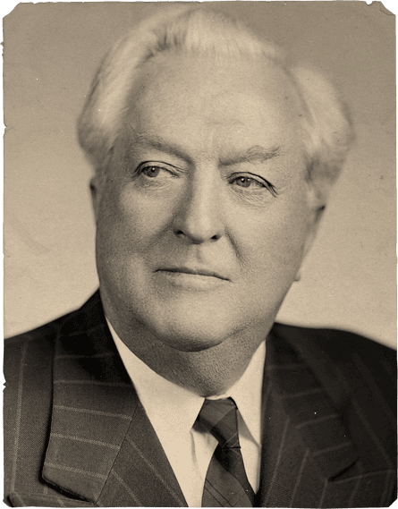 black and white portrait of a man in suit looking to side