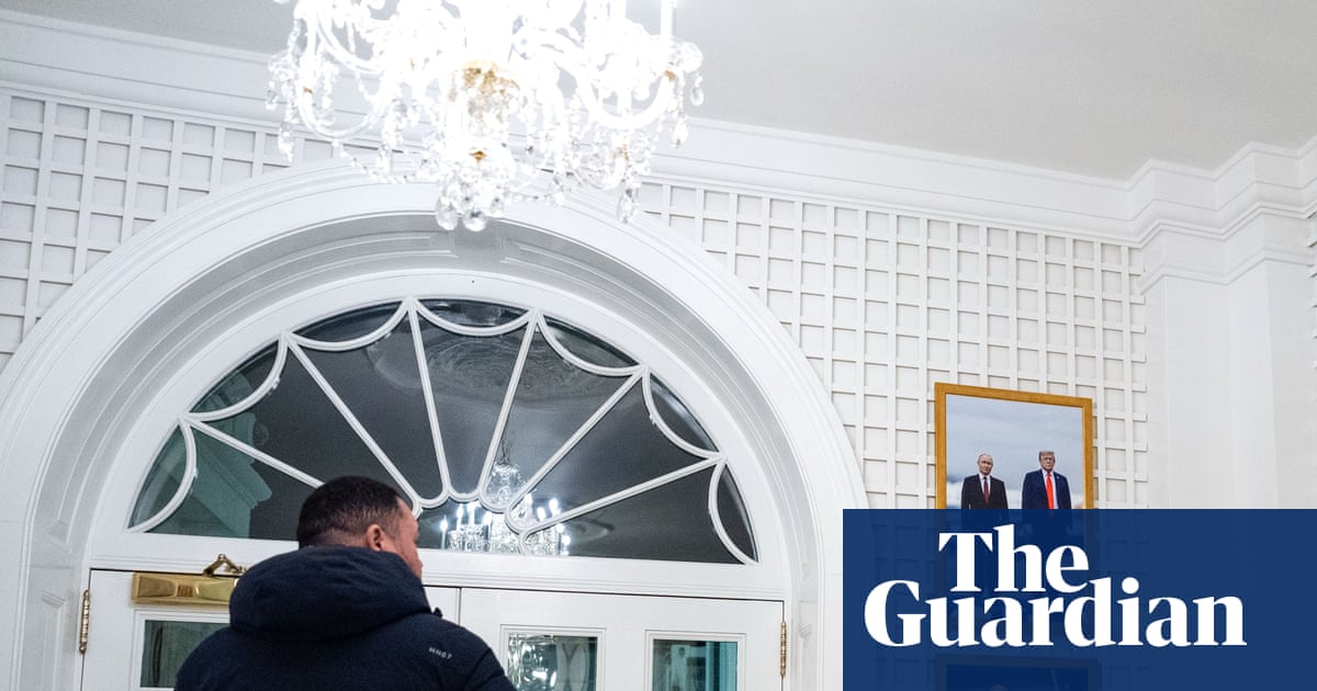 Critics aghast as White House displays framed photo of Trump with Putin