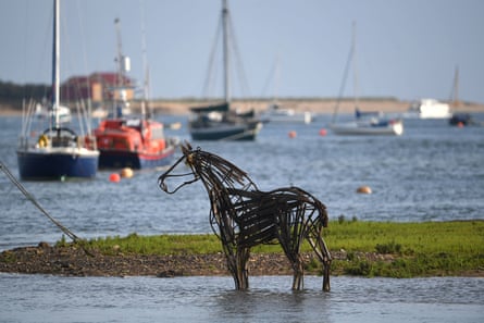 The Lifeboat Horse” sculpture by Rachael Long stands on the mud flats at Wells-next-the-Sea in Norfolk.