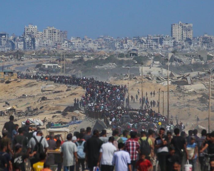 Palestinians begin journey to Gaza’s north as Israel says ceasefire now in effect – live
