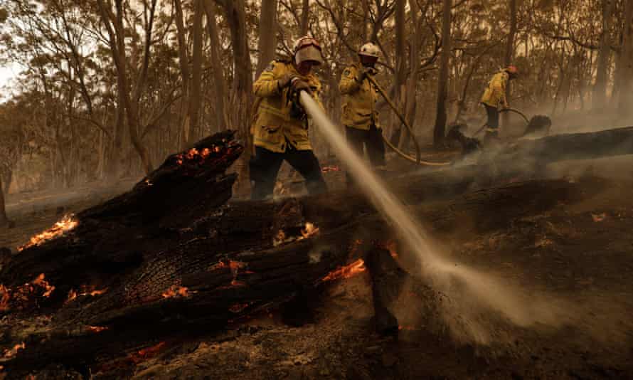 Firefighters try to contain a blaze in New South Wales last February.