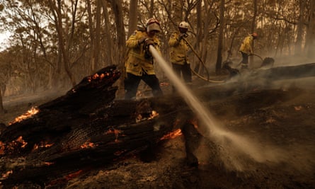 Firefighters try to contain a blaze in New South Wales last February.