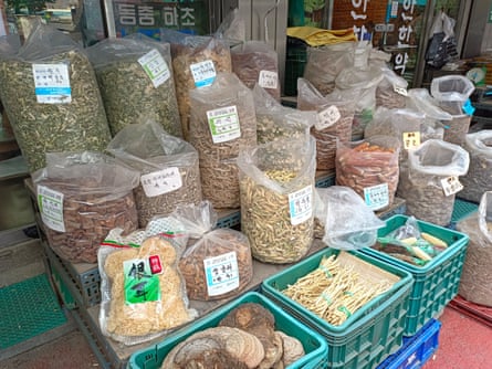 Bags of dried herbs and botanicals outside Joseon Yakcho, a traditional medicine shop in Seoul’s Yangnyeongsi Market.