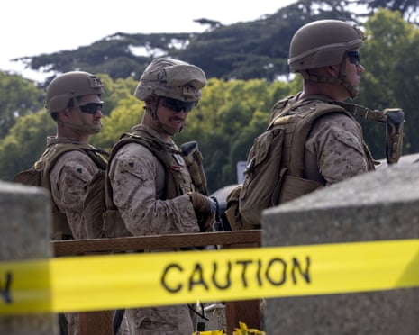 United States Marines stand guard outside the Federal Building in the Westwood area of Los Angeles, California after being deployed by President Donald Trump
