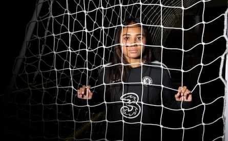 Alyssa Thompson looking through a goal net