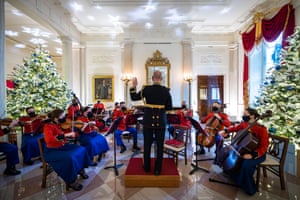 Members of the US Marine Band perform in the Grand Foyer during a press preview of the 2021 holiday decor at the White House.