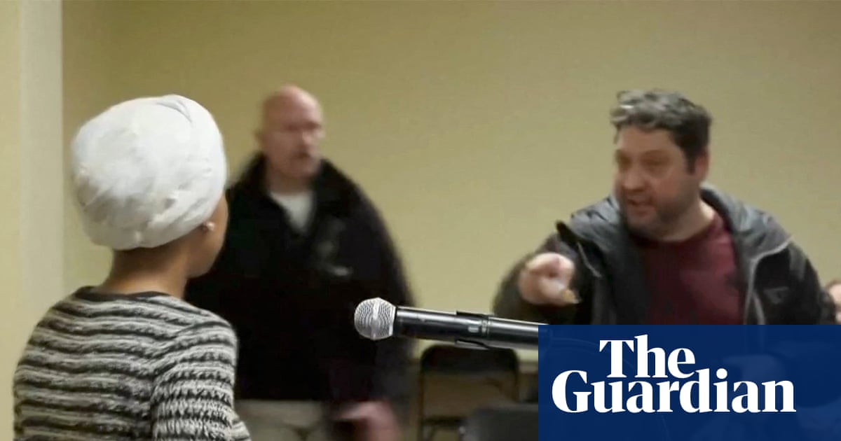 Security tackles man who sprayed unidentified liquid on Ilhan Omar at town hall – video