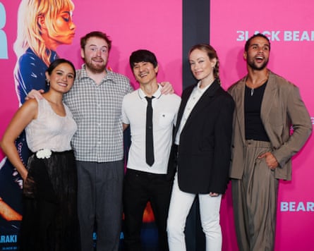 Group of men and women on red carpet