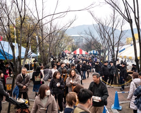 People at the Kure Oyster Festival walk between stalls