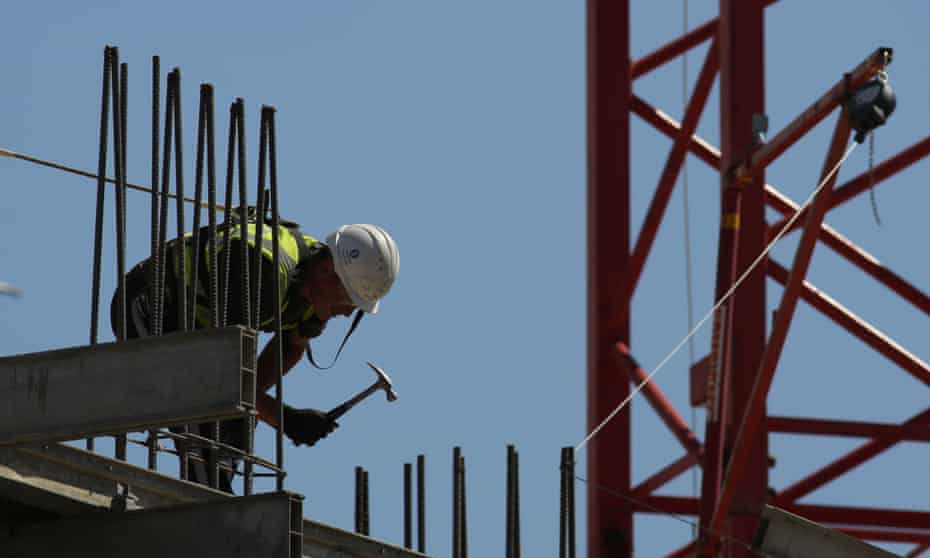 A construction worker works on a construction site in London