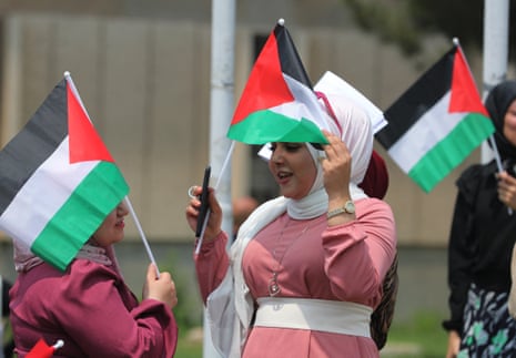 Iraqi university students and professors carrying Palestinian flags during a rally at Al-Nahrain University in Baghdad on Thursday in solidarity with Gaza and pro-Palestinian protests at US universities.