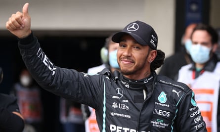 Lewis Hamilton celebrates taking pole position for the sprint race