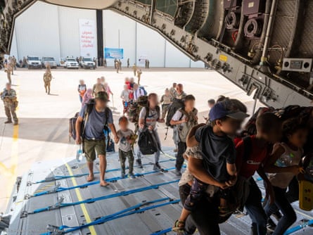 French and other nationalities board a plane at the French military airbase in Khartoum to fly to Djibouti.