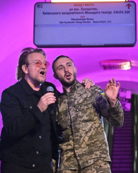 Taras Topolia and Bono singing in an underground station