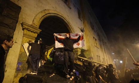 Demonstrators set up a barricade to block the side entrance of Georgian parliament during a rally against a controversial ‘foreign influence’ bill on 1 May.
