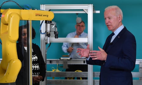 Joe Biden and a robot arm