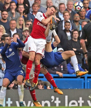 Laurent Koscielny receives a boot in the face from David Luiz as he attempts an overhead kick as Arsenal draw 0-0 with Chelsea at Stamford Bridge.
