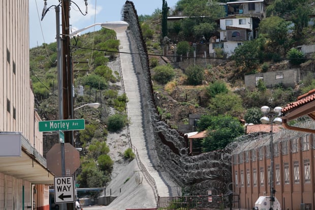 The border wall separating Nogales, Arizona from Nogales, Mexico. The Arizona city has suffered an enormous economic impact from the border closure.