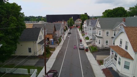 A data center towers over a residential neighborhood