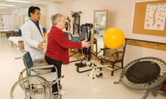Rehabilitation Therapist assists a senior citizen with coordination exercises