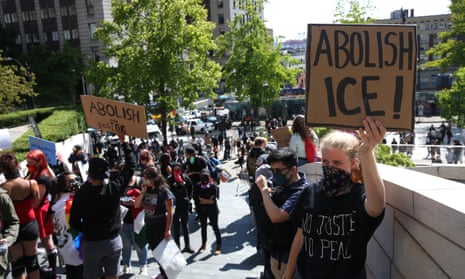 Protesters rally against Ice outside City Hall in Seattle. Human rights advocates says there has been a significant acceleration of deportations linked to the possibility that Ice could soon be under new management.