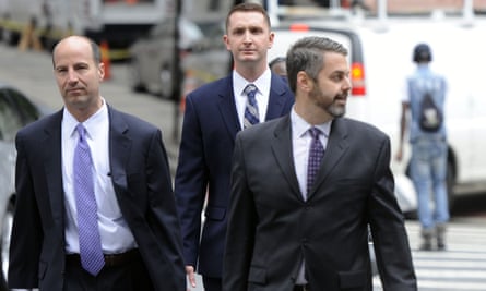 Baltimore police officer Edward Nero (center) and attorneys walk to the courthouse before a hearing on 10 May.