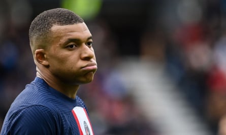 Kylian Mbappe looks unhappy during a PSG match