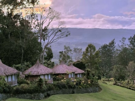 Thatched-roof round house rooms at Ambua Lodge, Papua New Guinea.