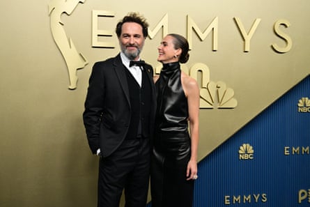 Matthew Rhys and Keri Russell pose for the cameras on the red carpet at the Emmy awards.
