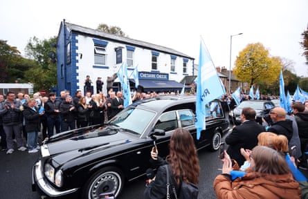 Mourners gather by the Cheshire Cheese pub in Hyde.