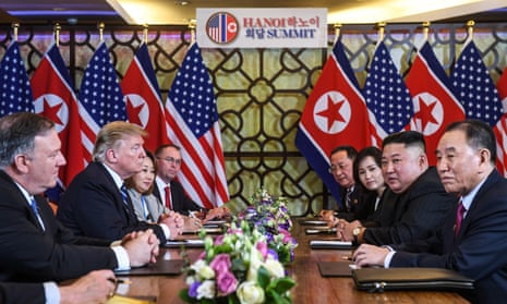 Donald Trump and North Korea's leader Kim Jong-un with staff at the Hanoi meeting.