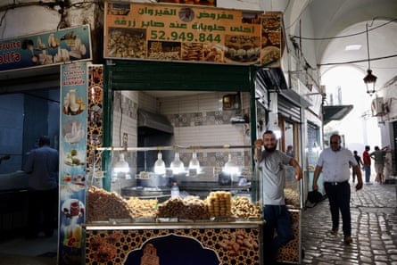 Sweet stalls in Tunis medina sell honey-coated fried dough and date-stuffed pastries.