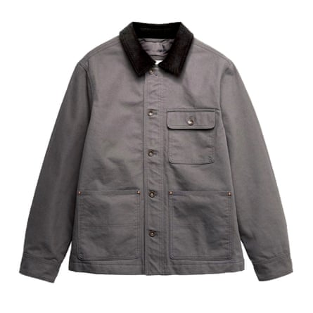 A grey cotton barn jacket with a black contrast collar on a white background