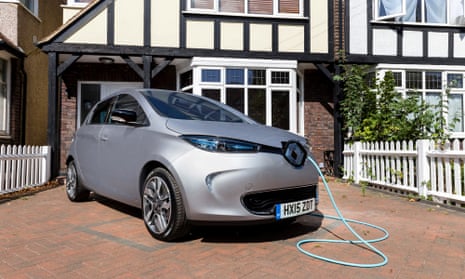 Renault charging in the drive of a house