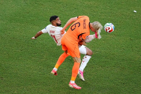 Ismael Saibari of Morocco and Jan-Paul van Hecke of the Netherlands compete for the ball.