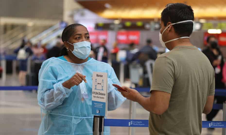 Covid testing at LAX airport. Health experts warned that infections and deaths will continue to soar in the coming weeks.