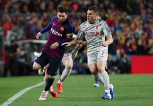 Liverpool’s James Milner fouls Barcelona’s Lionel Messi.