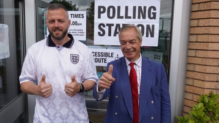 Robert Kenyon and Nigel Farage give thumbs up gestures outside a polling station