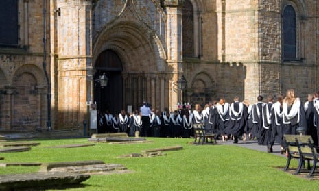 Graduands entering Durham Cathedral for a degree ceremony.