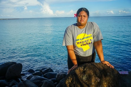 Lily Teafa standing on rocks at the water’s edge