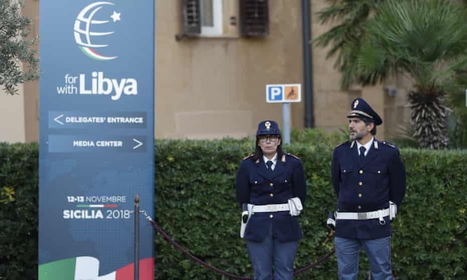 Police officers outside a Libya conference in Palermo, Italy